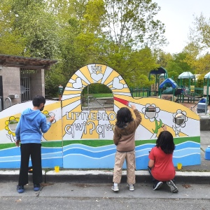 children painting photo booth in park