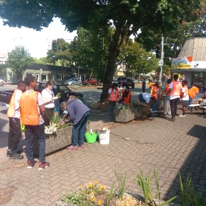 group of volunteers beautifying street